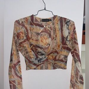 Orange Printed Mesh Cross Front Key Hole Long Sleeve Crop Top